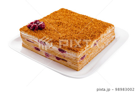 honey cake on plate isolated on white honey cake on plate isolated on white 98983002
