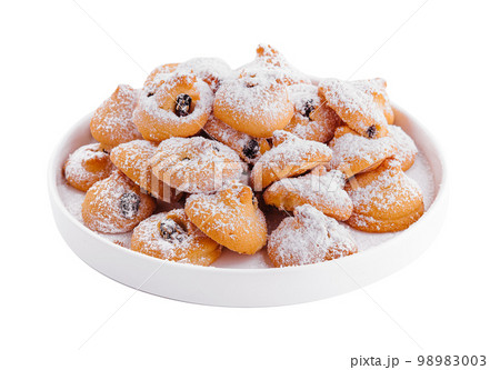 Christmas cookies with powdered sugar on plate 98983003