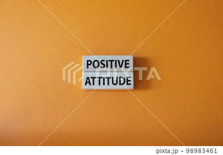 Positive attitude symbol. Concept words Positive attitude on wooden blocks. Beautiful orange background. Business and Positive attitude concept. Copy space. 98983461