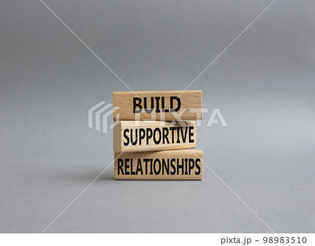 Build Supportive Ralationships symbol. Wooden blocks with words Build Supportive Ralationships. Beautiful grey background. Business and Build Supportive Ralationships. Copy space. 98983510