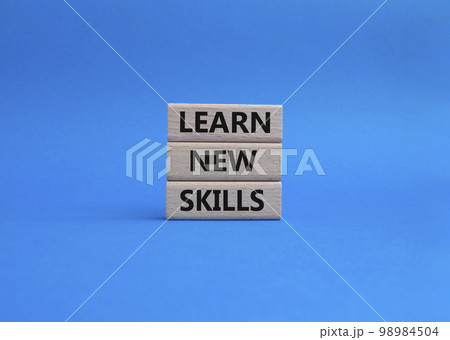 Learn new skills symbol. Concept words 'Learn new skills' on wooden blocks. Beautiful blue background. Business and Learn new skills concept. Copy space. Learn new skills symbol. Concept words 'Learn new skills' on wooden blocks. Beautiful blue background. Business and Learn new skills concept. Copy space. 98984504