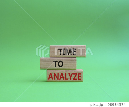 Time to Analyze symbol. Concept word Time to Analyze on wooden blocks. Beautiful green background. Business and Time to Analyze concept. Copy space 98984574