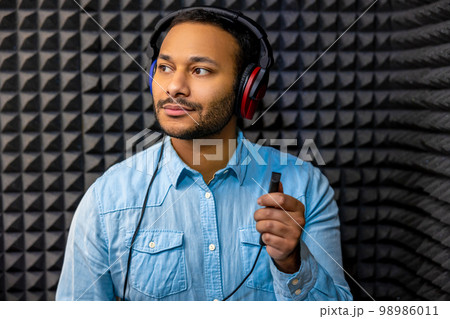 Young dark-haired man having a hearing checkup 98986011