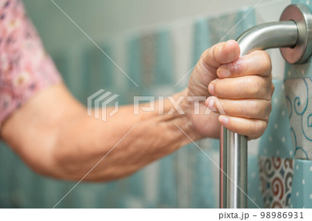 Asian senior or elderly old lady woman patient use toilet bathroom handle security in nursing hospital ward, healthy strong medical concept. Asian senior or elderly old lady woman patient use toilet bathroom handle security in nursing hospital ward, healthy strong medical concept. 98986931