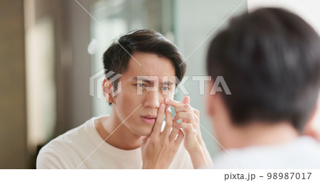 Asian man facial care 98987017