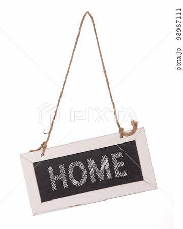 Wooden framed blackboard with chalk hanging at an angle 98987111