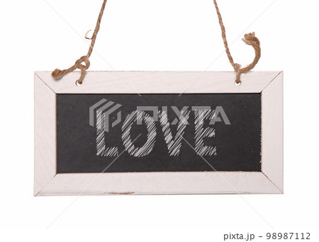 Wooden framed blackboard with chalk hanging 98987112