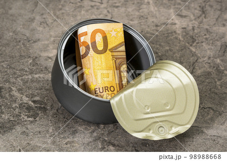 Fifty euro in a tin can falling on the stone background 98988668