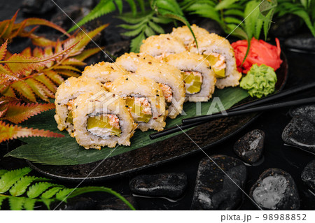 sushi rolls with mango and crab inside sushi rolls with mango and crab inside 98988852