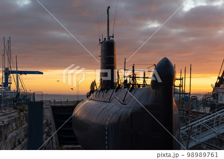 Submarine in the port on the background of sunset Submarine in the port on the background of sunset 98989761