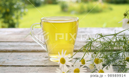 Glass cup of chamomile tea Glass cup of chamomile tea 98989914