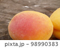 Apricots on a wooden board 98990383