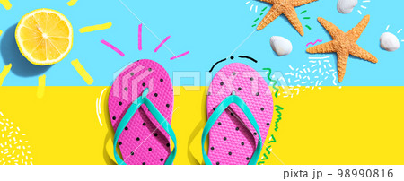Summer concept with flip flops and lemon sunlight Summer concept with flip flops and lemon sunlight 98990816