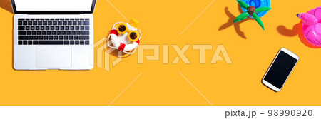 Laptop computer with summer theme items 98990920