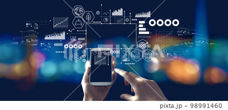 Eco theme with person using a smartphone at night 98991460