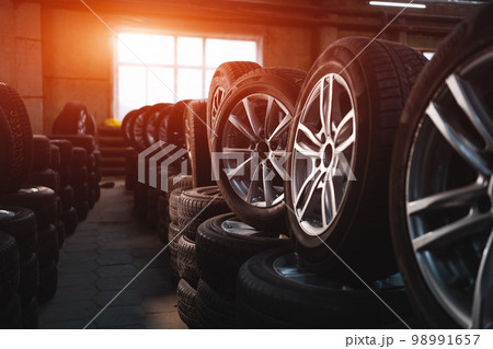 modern warehouse with stack of car tires 98991657
