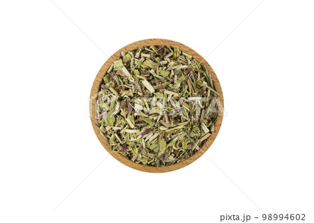 Catnip herb in latin - Nepeta cataria in wooden bowl isolated on white background. in wooden bowl isolated on white background. Medicinal herb. 98994602
