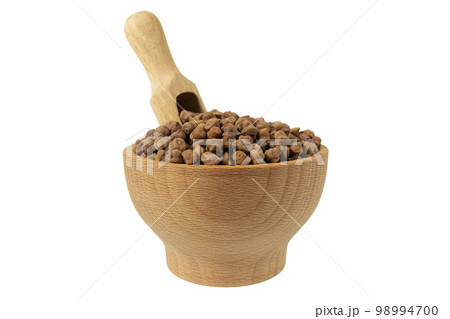 brown chickpeas in wooden bowl and scoop isolated on white background. nutrition. food ingredient. 98994700