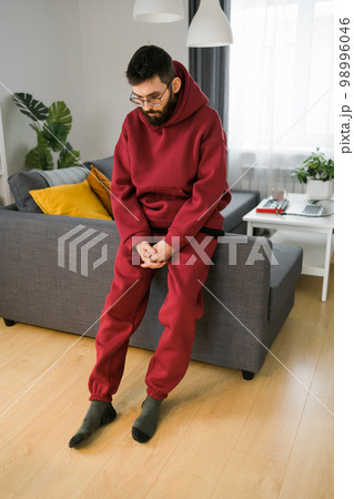 Sad man pondering about his life after a relationship breakup or bipolar disorder - depression asthenia , mental problem and anxiety disorder concept Sad man pondering about his life after a relationship breakup or bipolar disorder - depression asthenia , mental problem and anxiety disorder concept 98996046