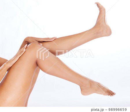 Wellness, beauty and legs of woman for skincare, grooming and shaving on white background studio. Cosmetics, pedicure and feet of girl for hair removal, laser treatment and epilation for smooth skin 98996659