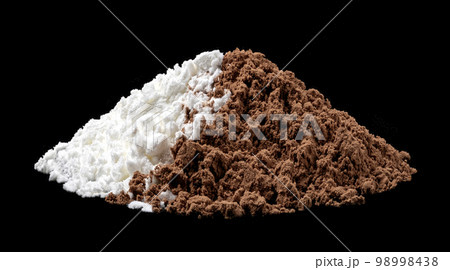 Cocoa powder and powdered sugar mix on black background Cocoa powder and powdered sugar mix on black background 98998438
