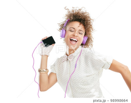 Dance, happy and black woman sing phone music, phone radio and online audio with freedom. White background, woman and happiness of isolated person streaming a dancing track with headphones and mobile 98998664