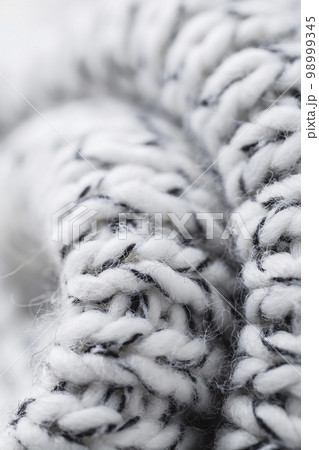 Texture of the fabric of a winter sweater Texture of the fabric of a winter sweater 98999345
