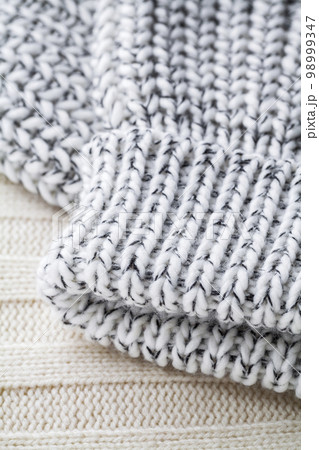 Texture of the fabric of a winter sweater Texture of the fabric of a winter sweater 98999347
