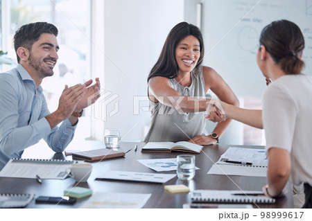 Partnership, applause and handshake by business people in support of collaboration, b2b and startup success. Job interview, hand shake and recruitment leader black woman hiring, employee and contract Partnership, applause and handshake by business people in support of collaboration, b2b and startup success. Job interview, hand shake and recruitment leader black woman hiring, employee and contract 98999617
