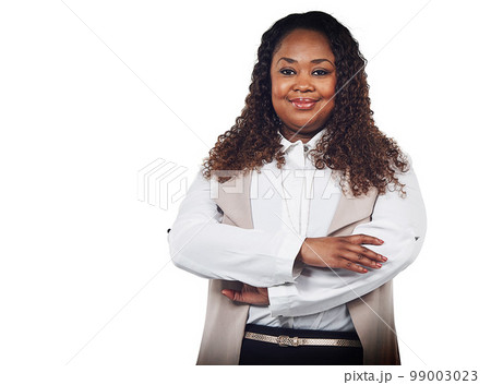 Smile, portrait and business woman in studio, proud and empowered against a white background. Happy, leader and confident black woman with ambitious, goal and mindset standing, confident and isolated Smile, portrait and business woman in studio, proud and empowered against a white background. Happy, leader and confident black woman with ambitious, goal and mindset standing, confident and isolated 99003023