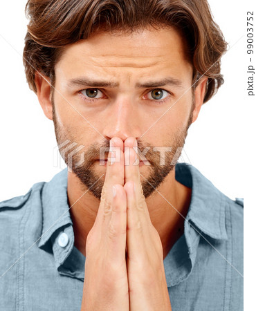 Portrait, man or anxiety and praying hands on studio background in mental health, stress burnout or nervous. Zoom, face or worried model and hope, prayer or wish gesture for good news, luck or change 99003752