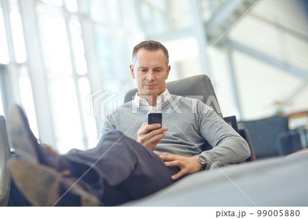 Thinking, travel or business man with phone thinking for invest strategy, finance growth or financial review. CEO, airport or manager with smartphone for planning, data analysis or economy research 99005880