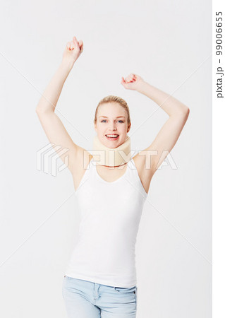 Happy, neck brace and portrait of a woman with freedom isolated on a white background. Smile, excited and girl with arms up for accident insurance, healthcare and medical attention with whiplash 99006655