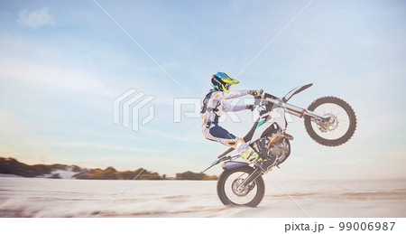 Motorbike, motorcycle athlete and desert drive with mockup cycling in nature for sport adventure. Jump, freedom and sports driving training of a man with speed on sand trail for fitness and exercise 99006987