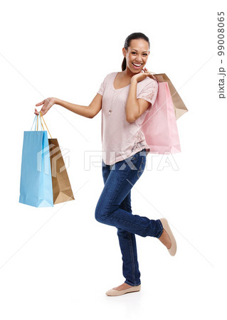 Studio, fashion and portrait of woman with shopping bags isolated on a white background. Black Friday discount, sales deals and happy female customer holding gifts after buying at mall, store or shop Studio, fashion and portrait of woman with shopping bags isolated on a white background. Black Friday discount, sales deals and happy female customer holding gifts after buying at mall, store or shop 99008065