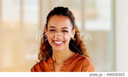 Latino business woman smiling and laughing with joy in an office. Portrait of a confident and ambitious young entrepreneur feeling motivated, empowered and optimistic for success in a startup company Latino business woman smiling and laughing with joy in an office. Portrait of a confident and ambitious young entrepreneur feeling motivated, empowered and optimistic for success in a startup company 99008365