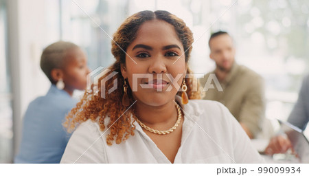 Face of a business woman in meeting with her corporate team in the office. Happiness, success and portrait of professional female employee from Mexico sitting in workplace discussion 99009934