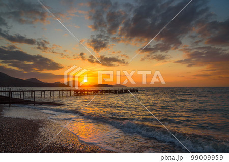 Colorful sunrise at sea Colorful sunrise at sea 99009959