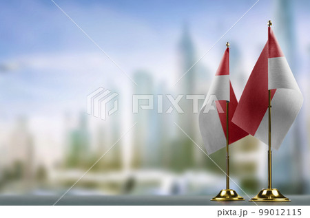 Small flags of the Singapore on an abstract blurry background Small flags of the Singapore on an abstract blurry background 99012115