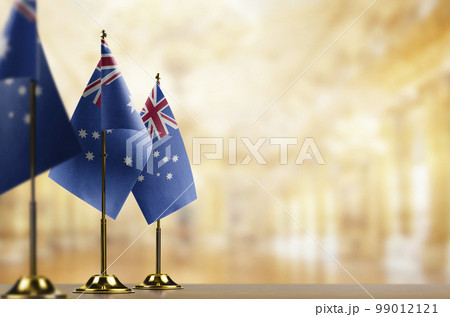 Small flags of the Australia on an abstract blurry background 99012121
