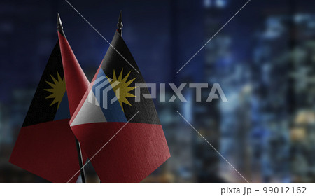 Small flags of the Antigua and Barbuda on an abstract blurry background 99012162