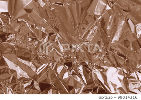 Brown foil leaf shiny texture, abstract wrapping paper for background and design art work. Brown foil leaf shiny texture, abstract wrapping paper for background and design art work. 99014316