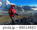 Hiker woman posing with mountains at background 99014662