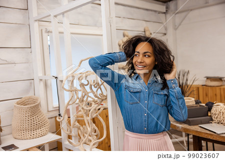 Young woman smiling and looking happy 99023607