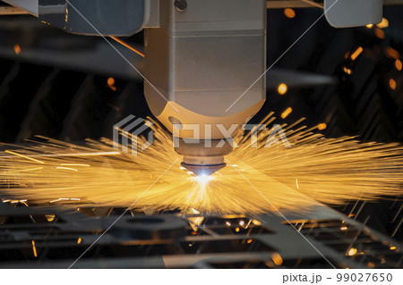 Close-up scene the fiber laser cutting machine cutting  machine cut the metal plate. 99027650