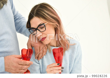 Happy young couple in love , drinking wine, celebrating Valentines day 99028226