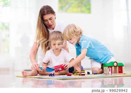 Boy playing toy cars. Kid with toys. Child and car 99029942