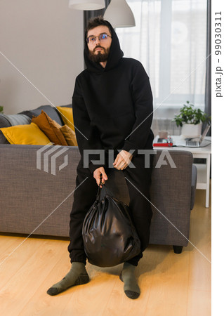 Sad man pondering about his life after a relationship breakup or bipolar disorder - depression asthenia , mental problem and anxiety disorder concept 99030311