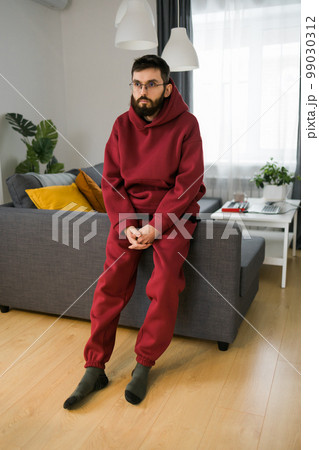 Sad man pondering about his life after a relationship breakup or bipolar disorder - depression asthenia , mental problem and anxiety disorder concept 99030312