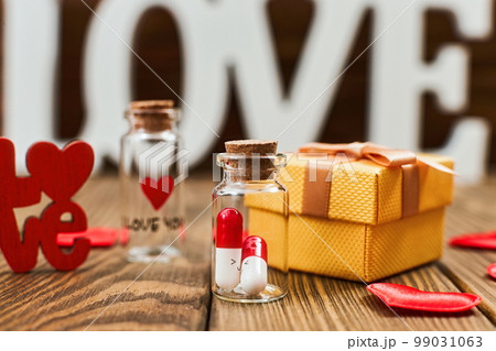 Concept of Valentine's, anniversary, mother's day and birthday greeting, copyspace, topview.Love medicine. I love you .Tablets in jars are kissing, Happy Valentine's Day, 99031063